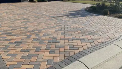 Interlocking paver driveway installation in Redding, CA showcasing clean lines and expert landscaping work